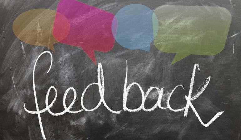 Feedback geven Feedback in krijt op schoolbord